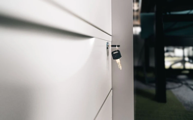 Close-up of a key in an office cabinet lock