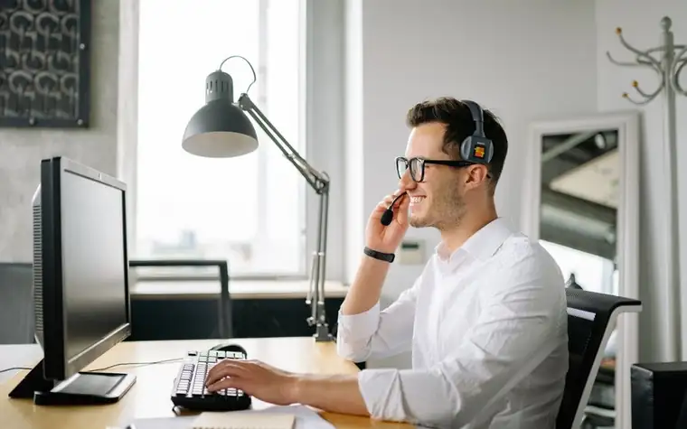 Smiling customer service representative wearing a headset
