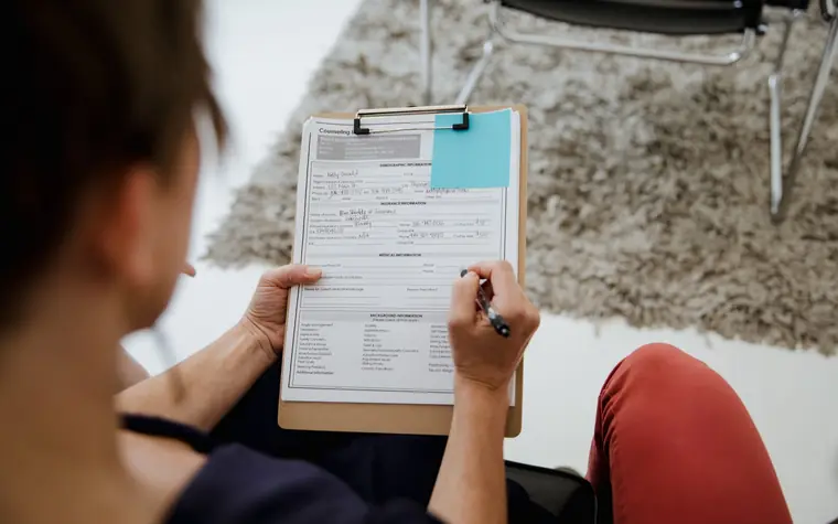 A person filling out a customer satisfaction survey