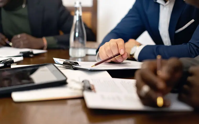 A team reviewing documents at a meeting table